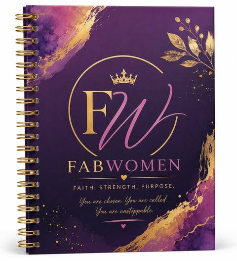 Purple and gold spiral notebook with FabWomen logo, crown, floral accents, and motivational text about faith, strength, and purpose