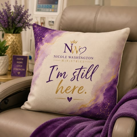 Designer throw pillow with purple watercolor design and Nicole Washington Ministries branding displayed on a cozy setting