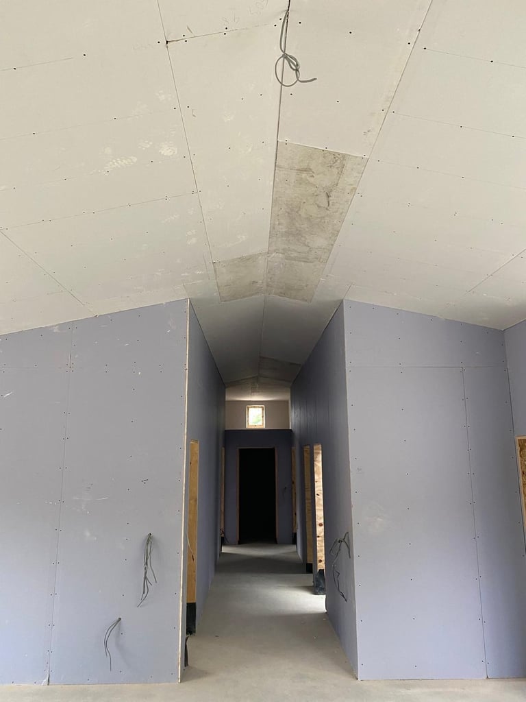 MF ceiling framework in progress, ducting and cabling visible, commercial fit-out.
