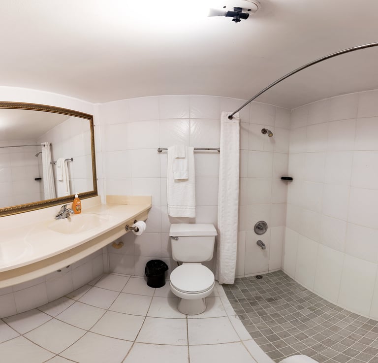 Modern bathroom with white subway tiles and glass-enclosed shower