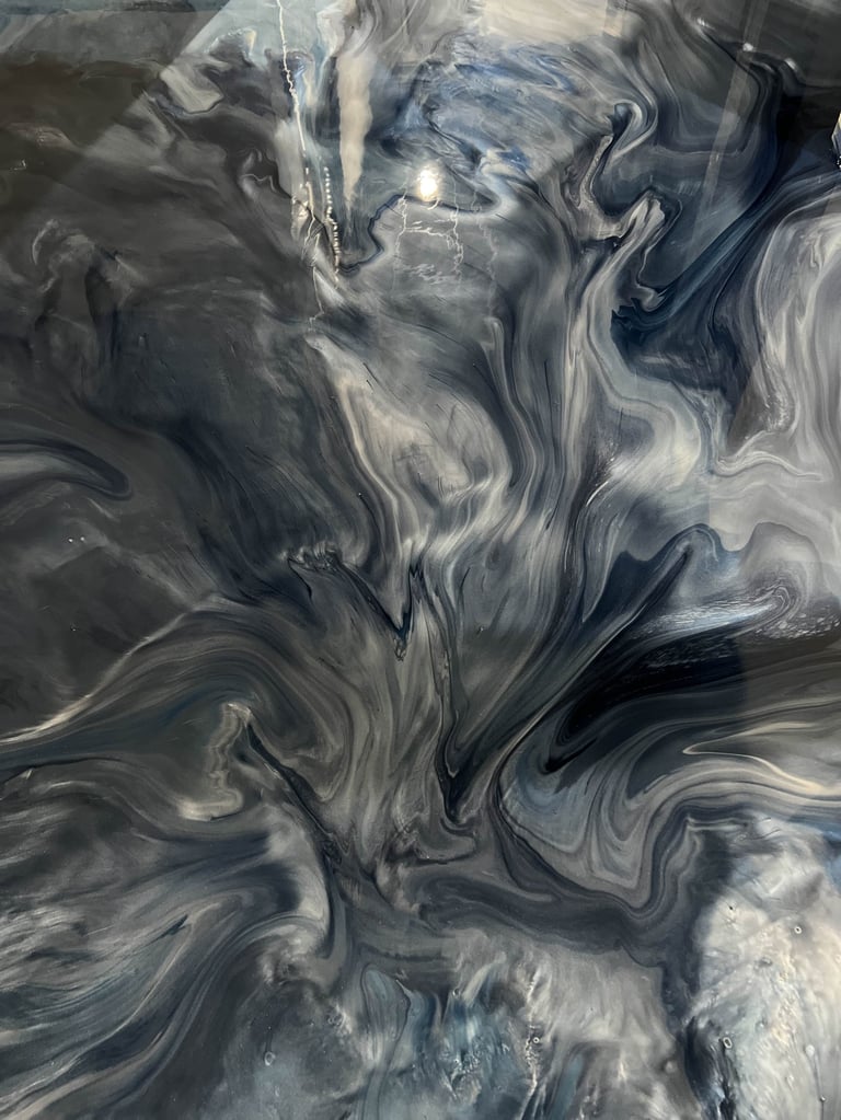 Metallic epoxy floor with high-gloss finish — abstract marbled flow pattern