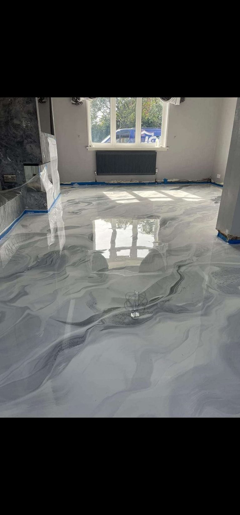 Metallic epoxy floor with high-gloss topcoat — rich swirls and depth