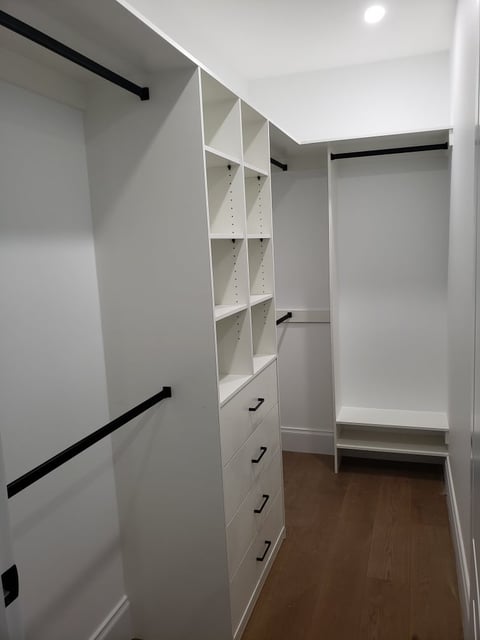 Custom white walk-in wardrobe with shelving and drawers by The Wardrobe Guy