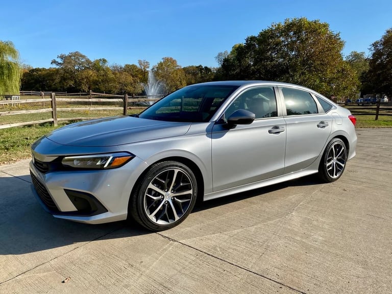 Silver Honda Civic sedan — sporty reliable economy rental