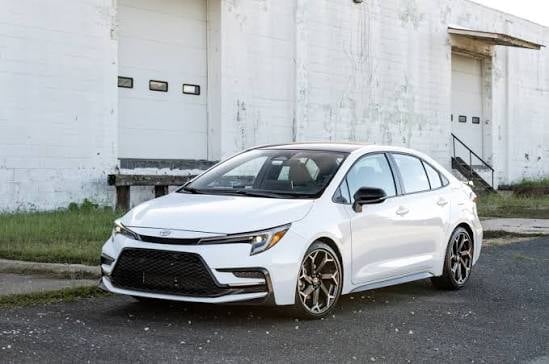 White Toyota Corolla sedan — dependable economy rental