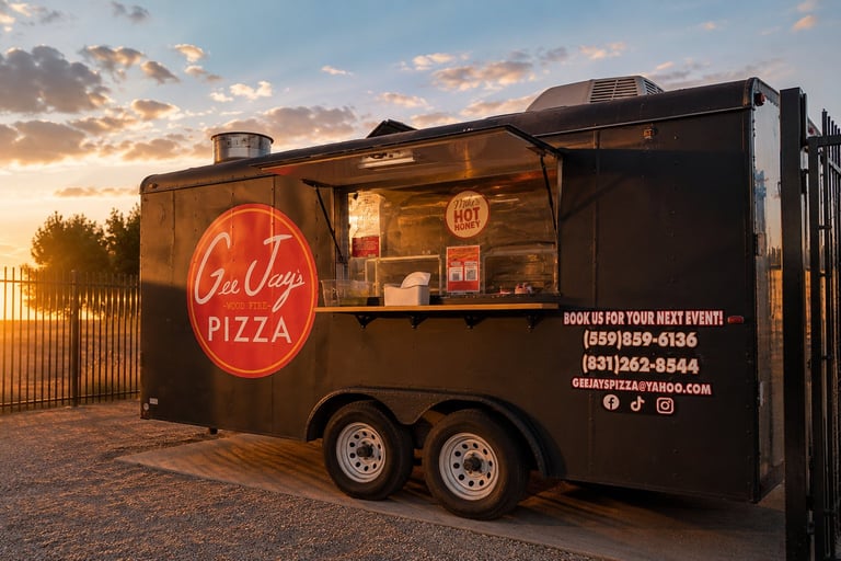 La Vie Pizza food truck at sunset with illuminated neon sign and serving window