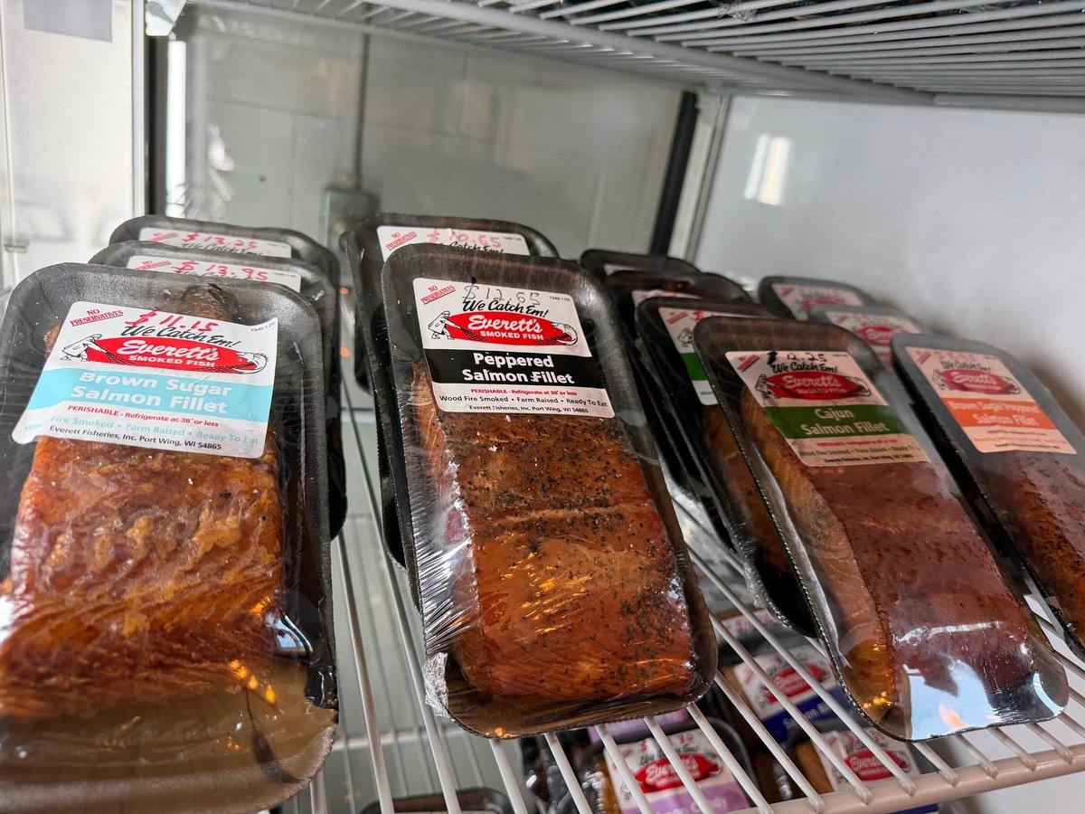Refrigerated case of locally smoked fish fillets including brown sugar and peppered salmon from Everett's Smoked Fish