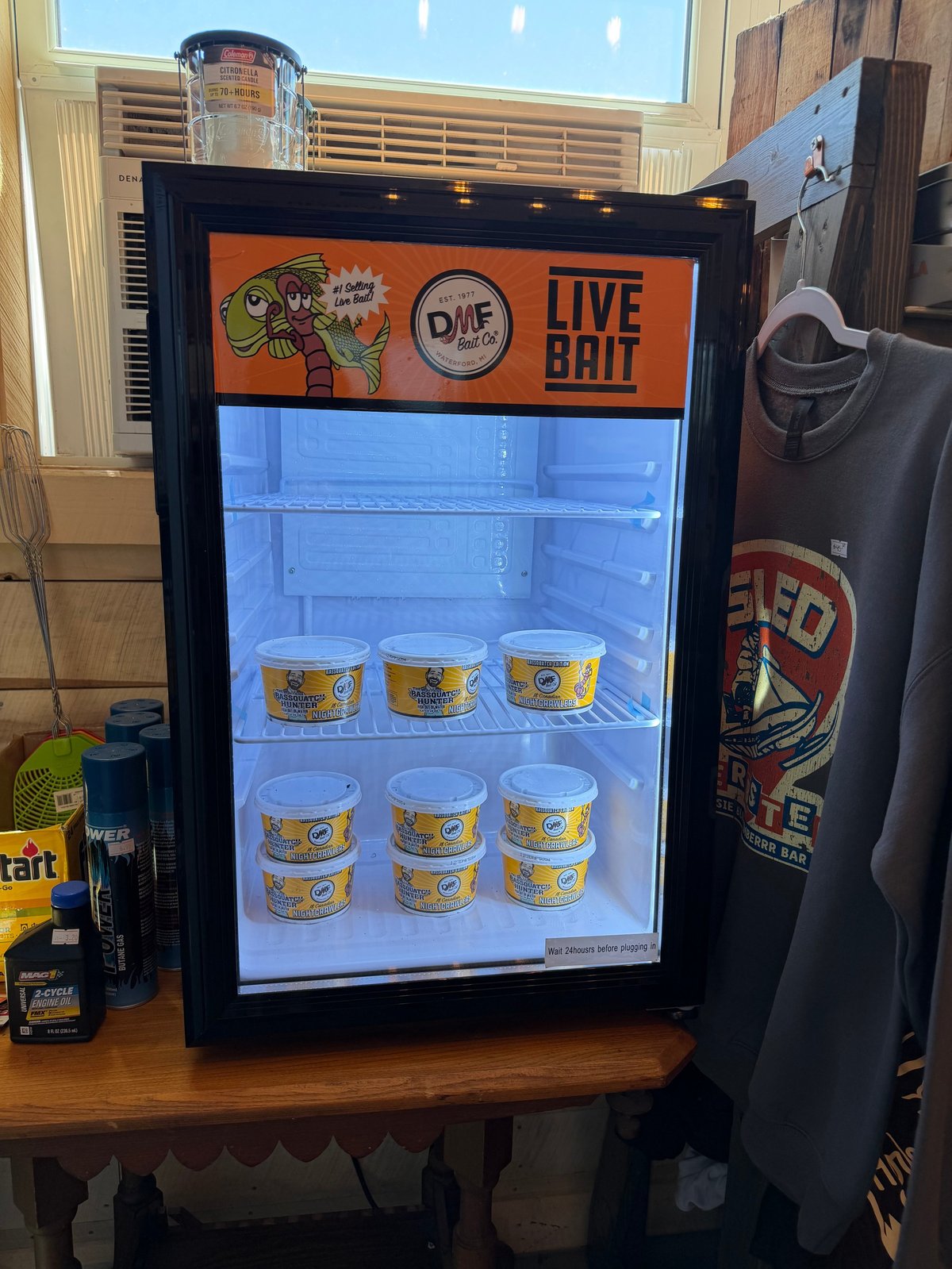 Live bait cooler stocked with nightcrawlers at the Elsie Blue General Store counter