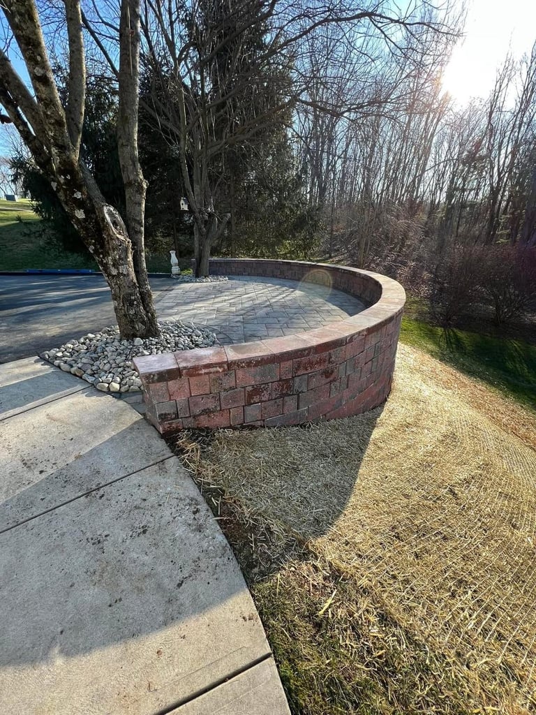 Curved Retaining Wall & Patio by Damare Landscaping