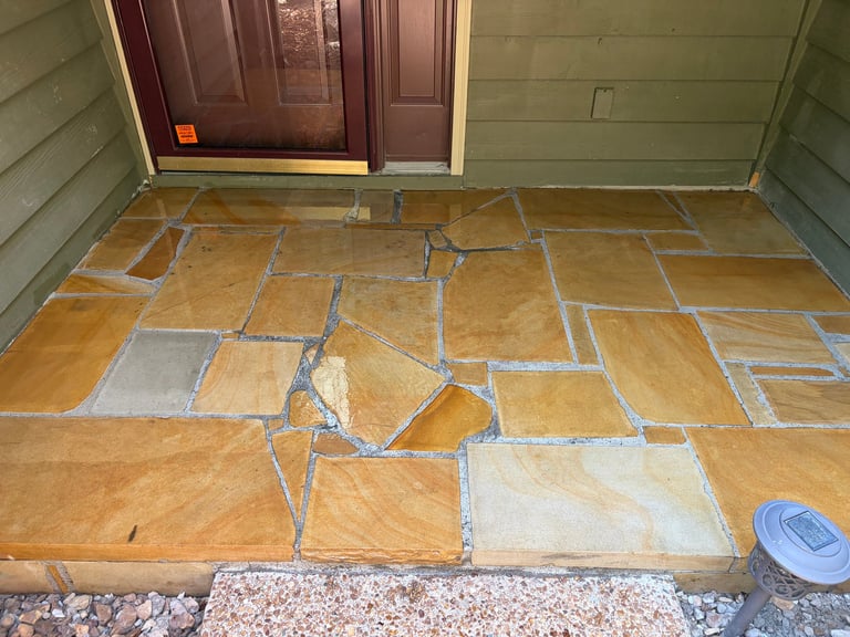 Cardboard floor layout with taped sections in entryway during renovation or construction project