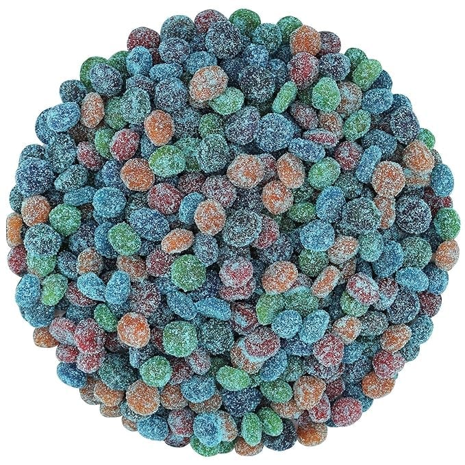 A circular arrangement of colorful sour gumballs or sour candy spheres in blue, green, pink, and orange colors coated with sugar crystals.