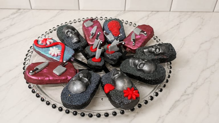 Collection of red and black miniature decorative shoe ornaments arranged on a beaded circular platter