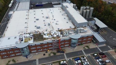 Mixed-use building with industrial roof and solar panels