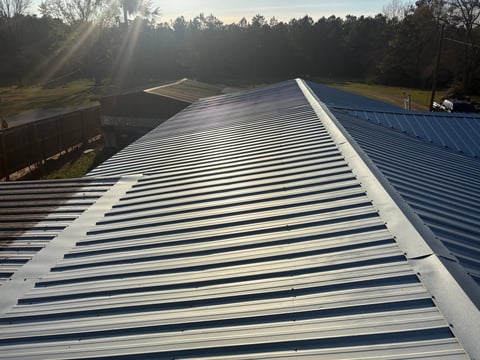 Commercial metal corrugated roof with white and blue panels