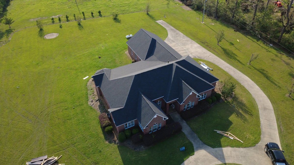 Modern brick home with dark roof in Brookhaven Mississippi service area