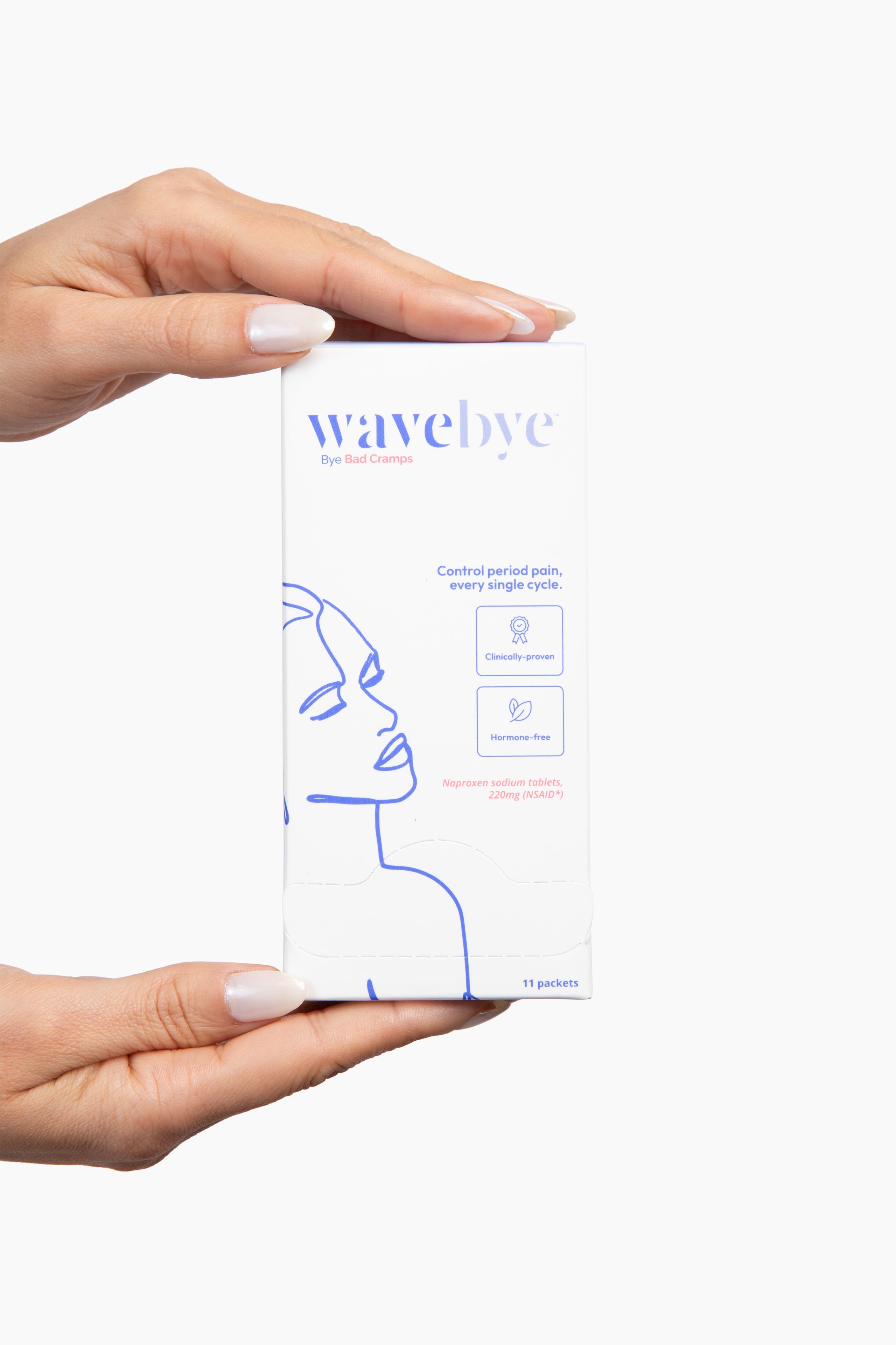 Two hands holding a white Wavebye birth control product box with blue line illustrations and text against a light background