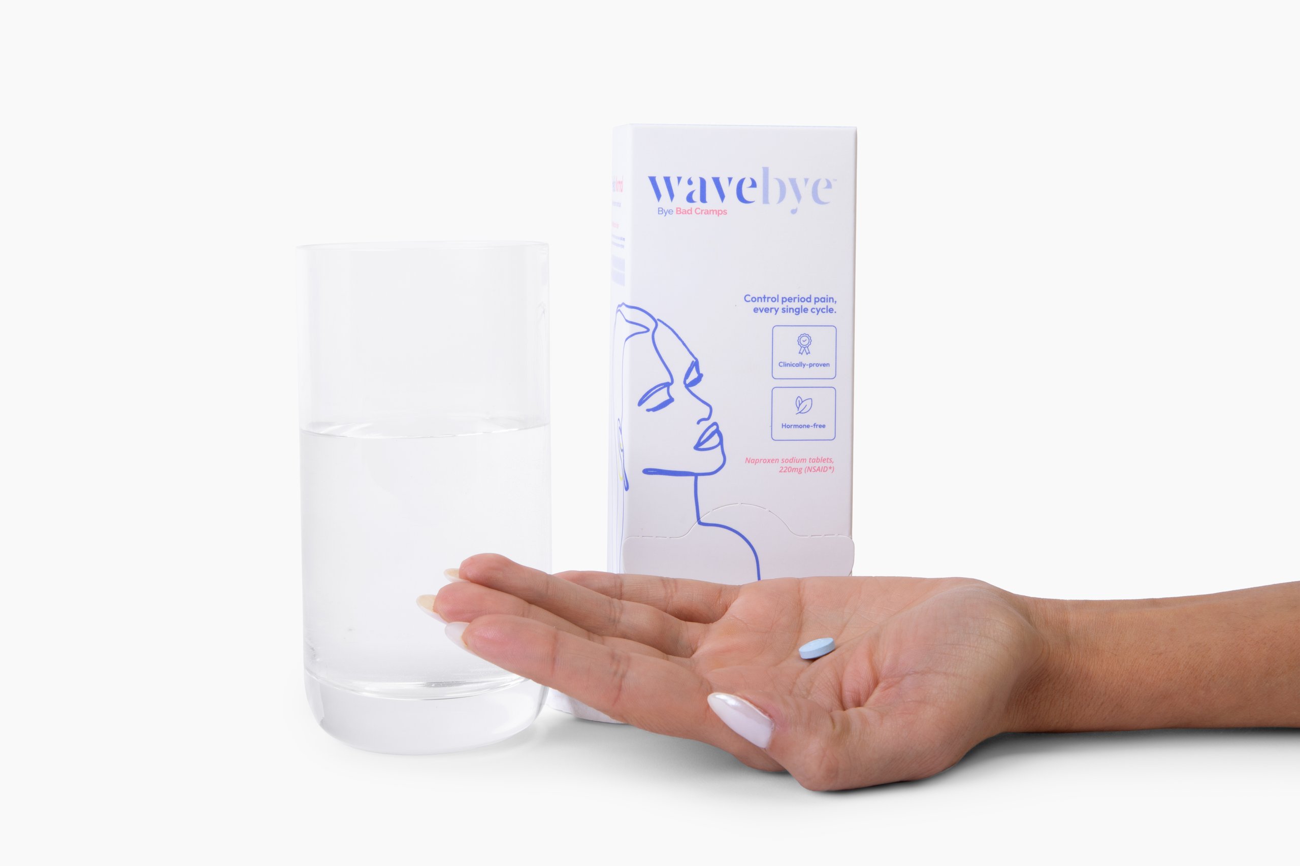 Hand holding Wavebye product box next to clear glass bottle on white background