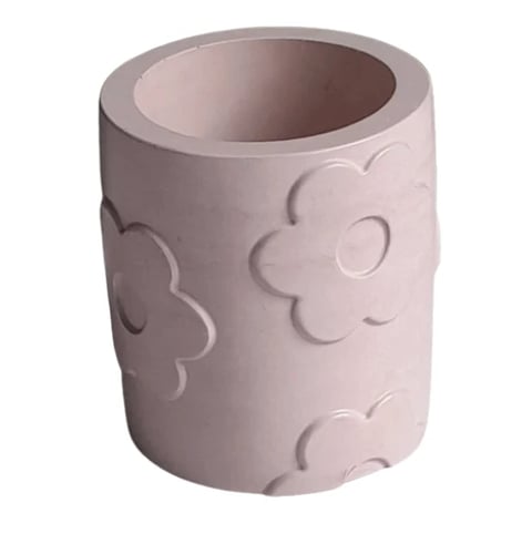 Pink ceramic cylindrical container with embossed flower and cloud designs