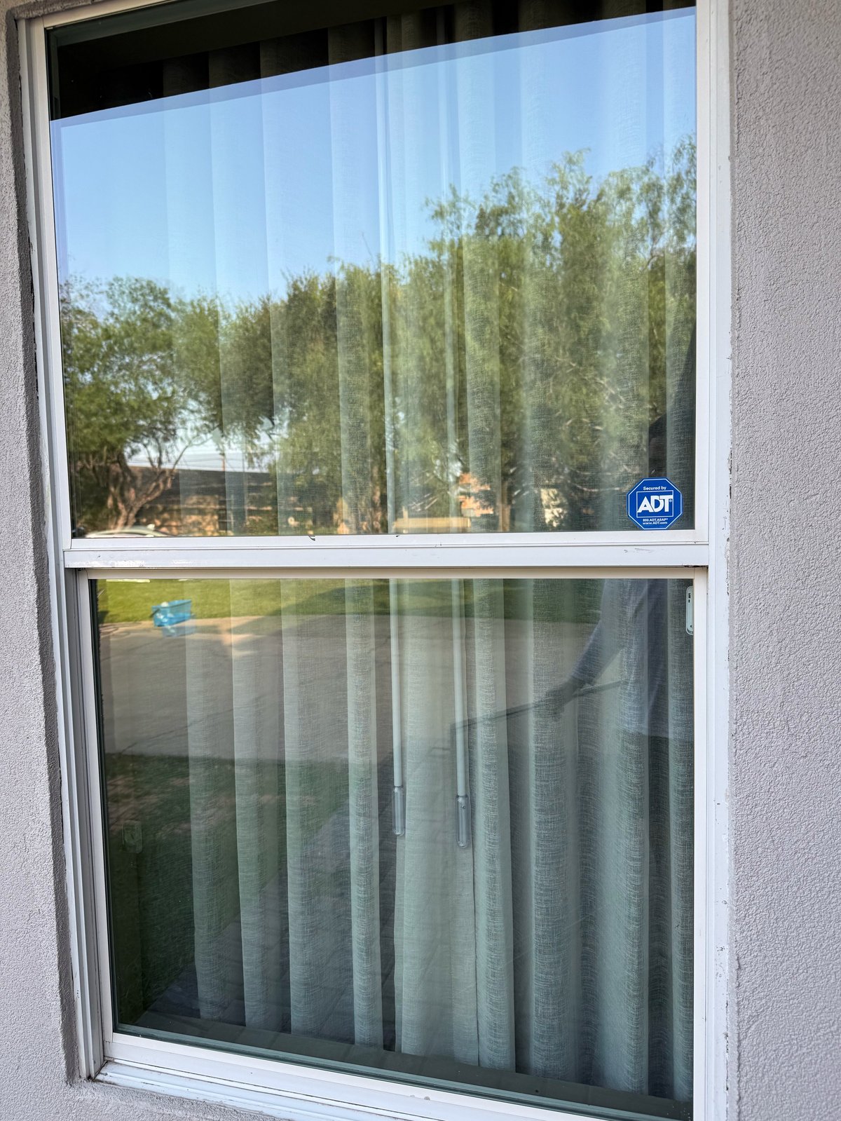 After: spotless, streak-free window with crystal-clear view