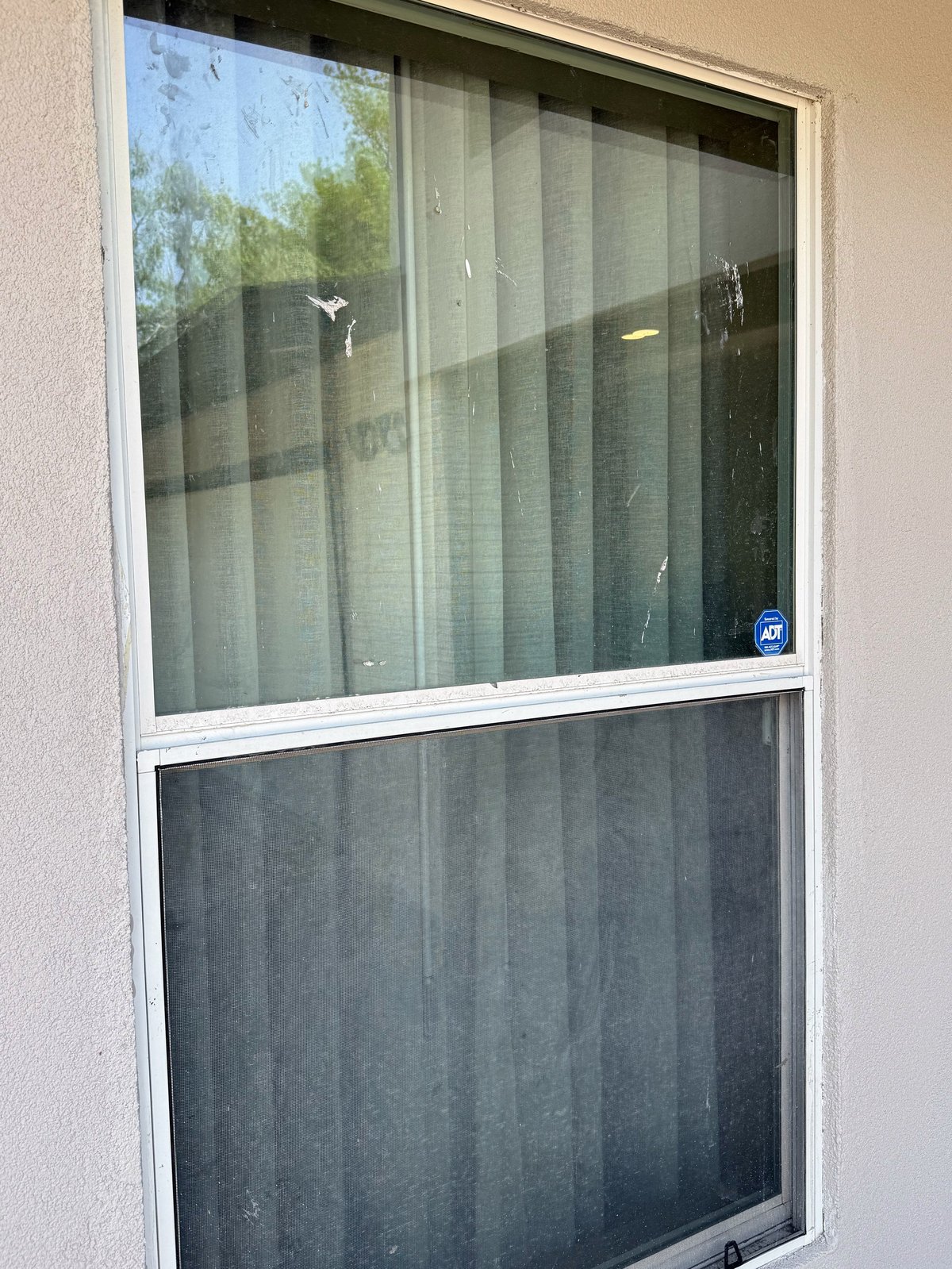Before: dirty window with smudges, stains, and dust buildup