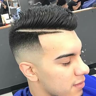 Man with modern undercut hairstyle, short faded sides and thick swept-back hair on top, shown in profile view at a salon