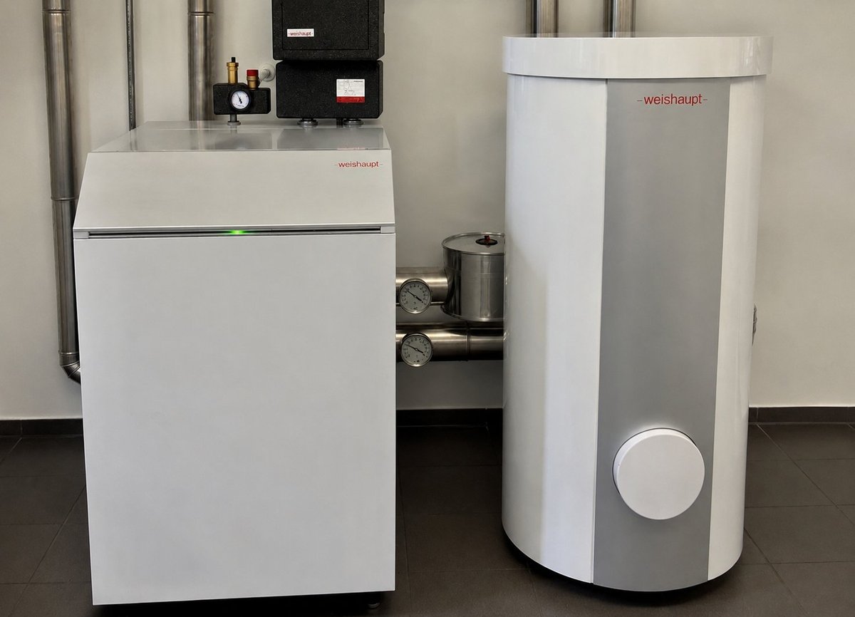 Laboratory water purification system with white filtration unit and cylindrical storage tank connected by tubing