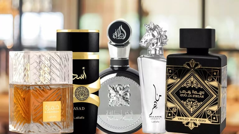 Collection of luxury Arabic perfume bottles in various sizes with gold, black, and crystal designs on display
