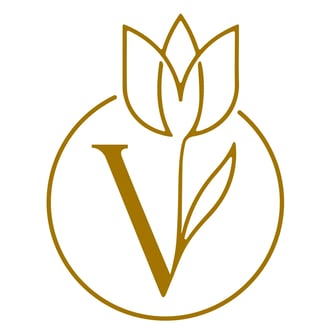 Gold tulip flower with letter V inside circular outline logo design