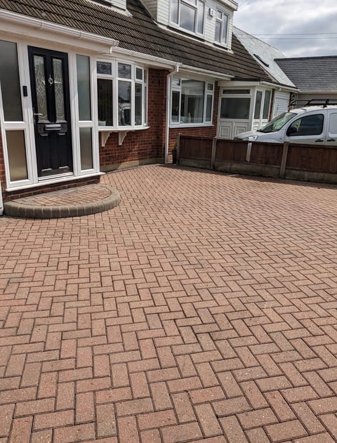 Red brick herringbone paved driveway after professional pressure washing Thurrock Essex