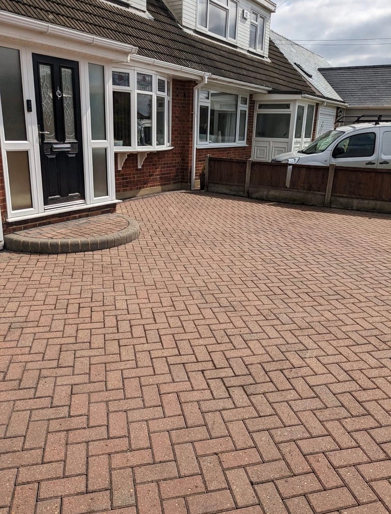Red brick herringbone paved driveway after professional pressure washing service Thurrock Essex