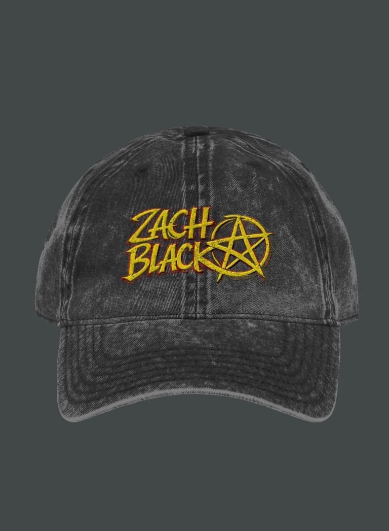 Charcoal gray baseball cap with yellow Zach Black logo and pentagram star design on front