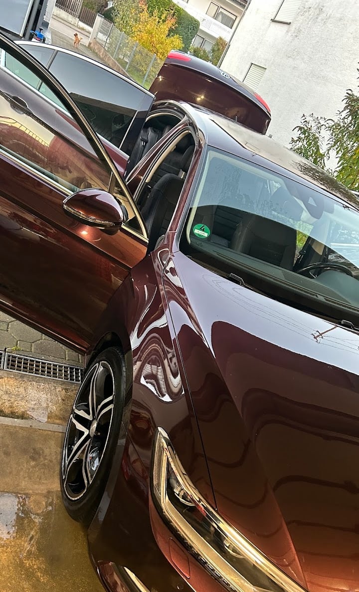 Two burgundy vehicles in residential driveway