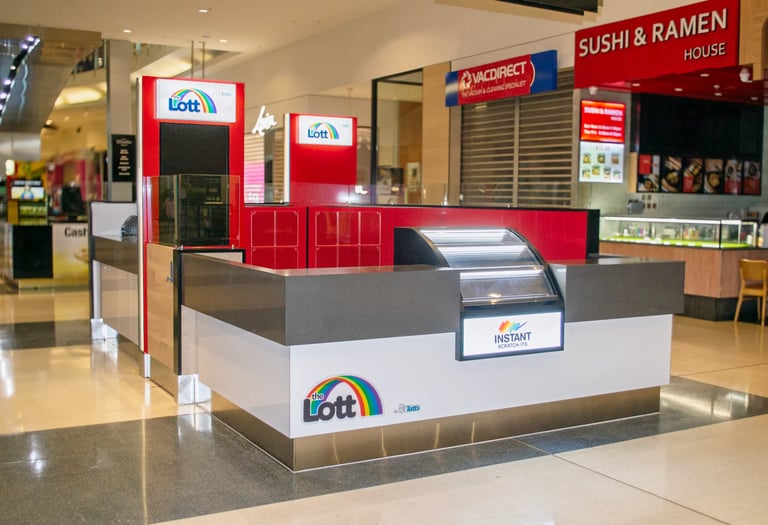 JHB Shopfitters commercial fit-out: food court kiosk with custom joinery counters, brand signage and display cabinetry in a Victorian shopping centre