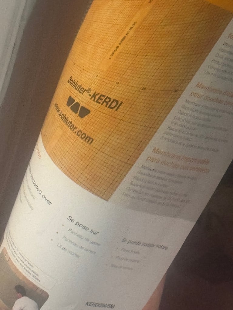 Close-up of product packaging showing yellow corrugated material with Schlueter-KERDI branding