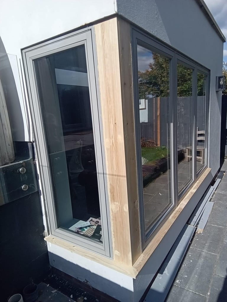 Bespoke garden room with light wood trim and large glass windows built by Loyalty Properties