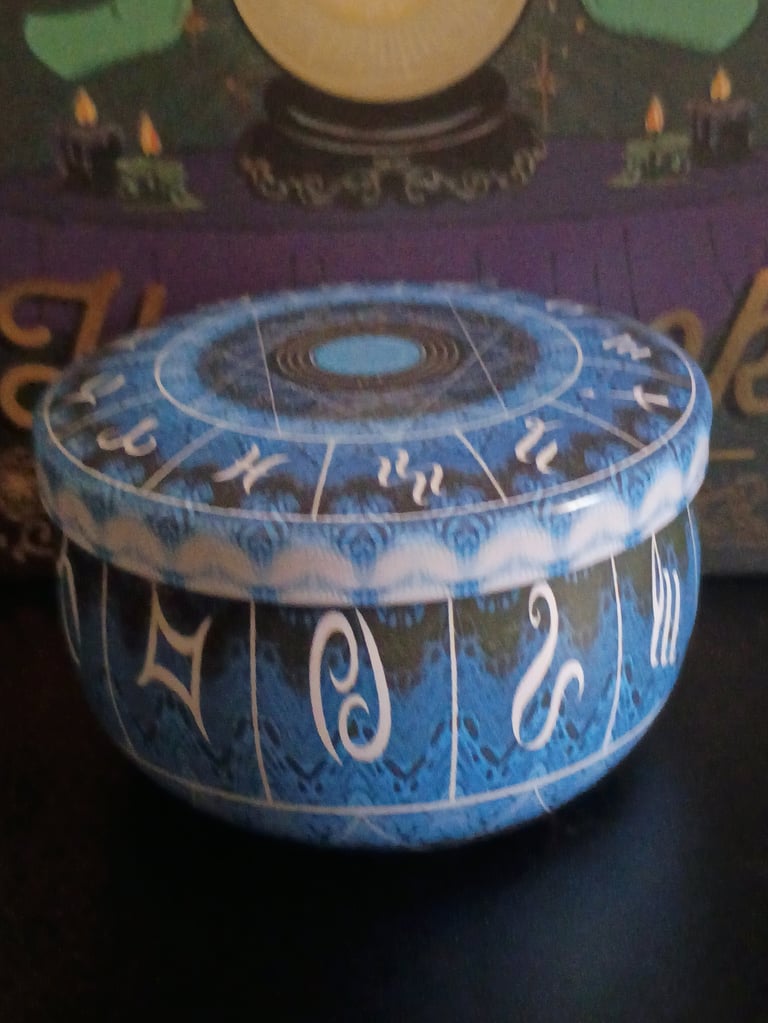 Blue zodiac astrology box with astrological symbols and circular wheel design on lid