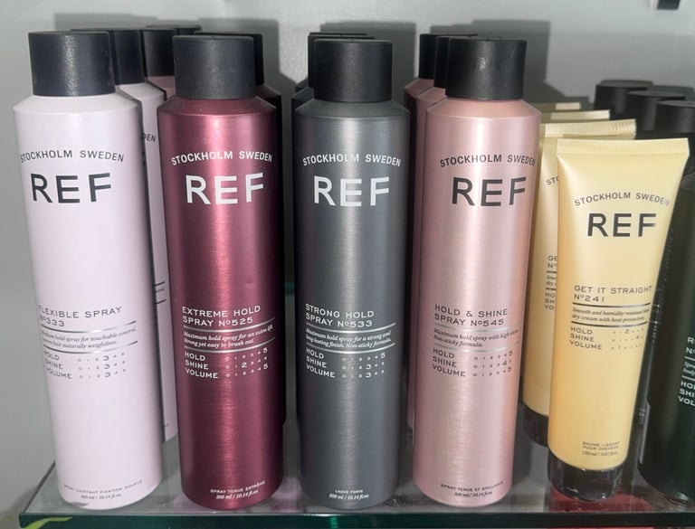 REF Stockholm Flexible Spray, Extreme Hold Spray, Strong Hold Spray, Hold and Shine Spray, and Get It Straight products on display.
