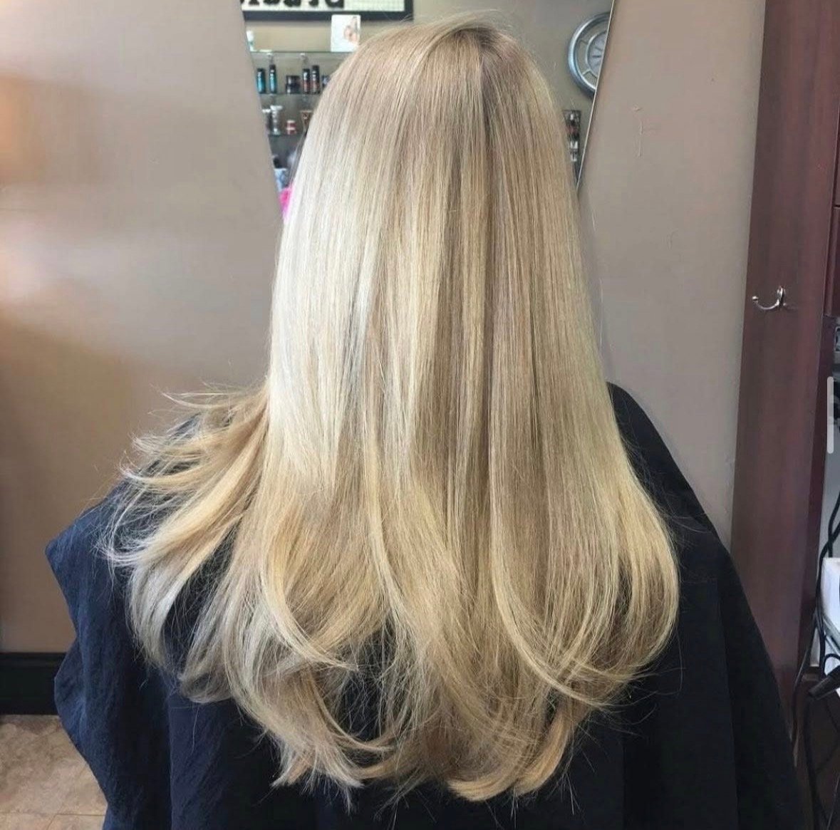 Back view of long, straight, bright blonde hair.