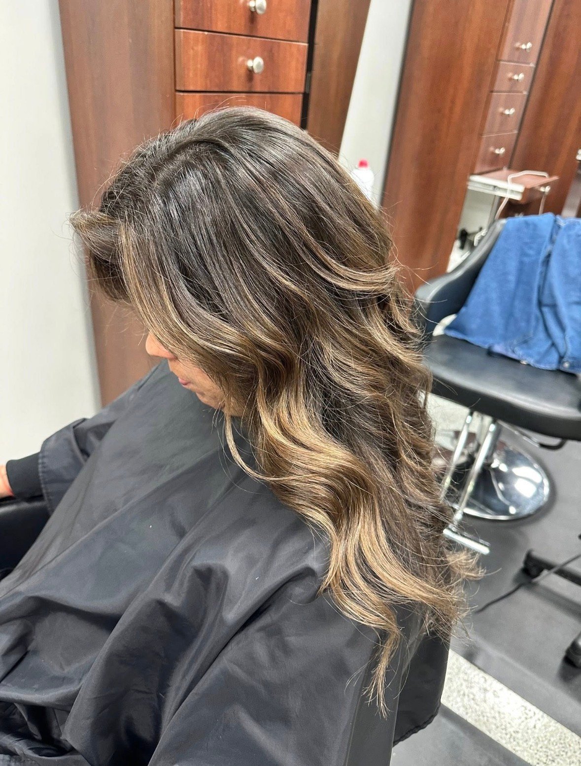 Back view of long, wavy, highlighted bronde hair.