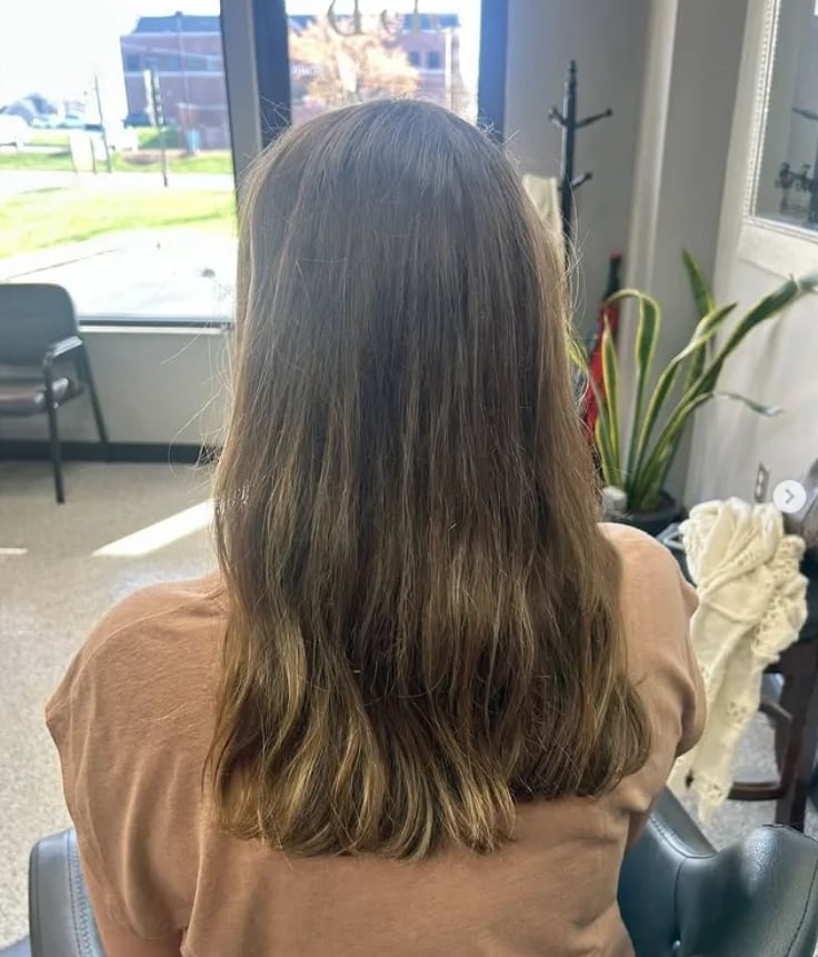 Back view of long, dark, wavy hair.