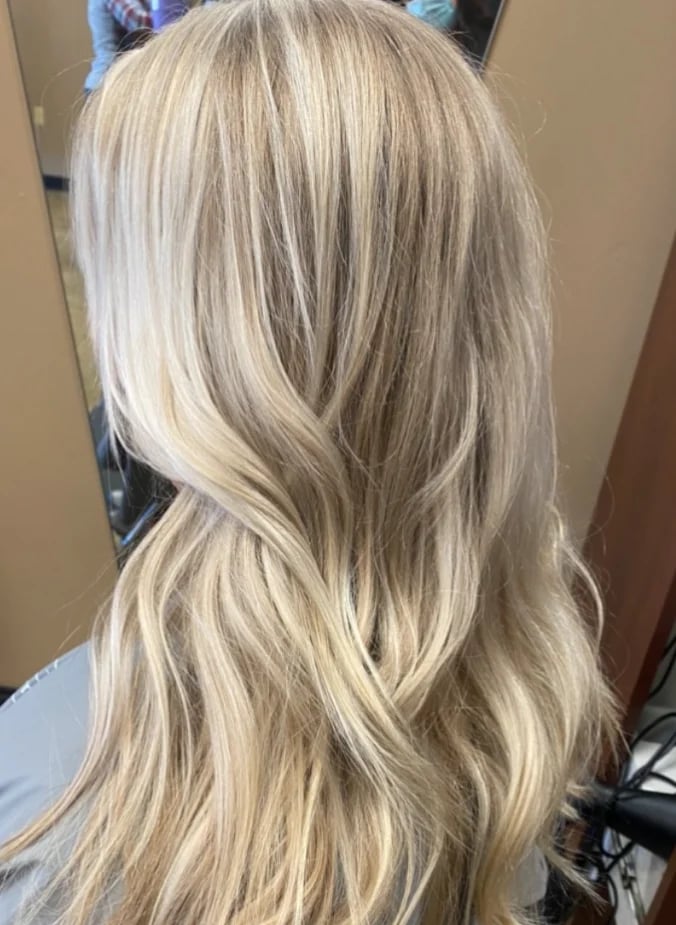 Back view of long, wavy, light ash blonde hair.