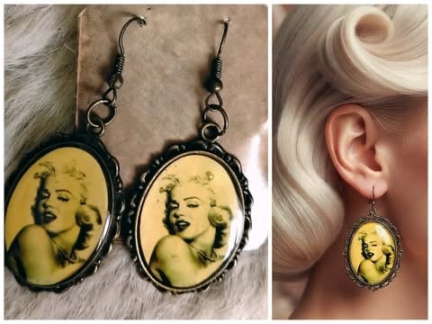 Pair of black framed oval earrings with yellow portrait of Marilyn Monroe, shown on white fur and worn on earlobe