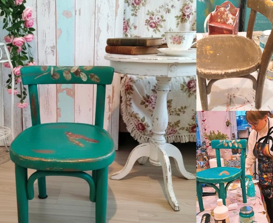 Vintage wooden furniture styled with distressed green chair, white pedestal table, and floral wallpaper backdrop in cottage aesthetic