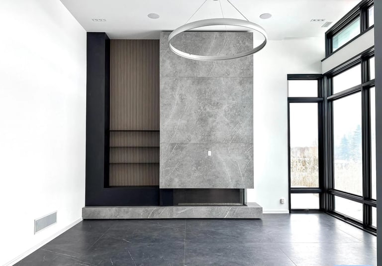 Modern minimalist interior with marble feature wall, concrete floors, and floor-to-ceiling black-framed windows