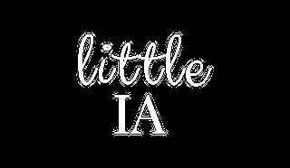 White cursive and serif text reading little IA on a black background