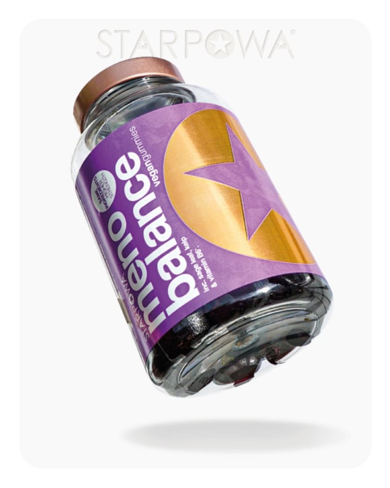 Purple Herbal Essence bottle tilted at an angle with gold lightning bolt design and bronze cap on white background