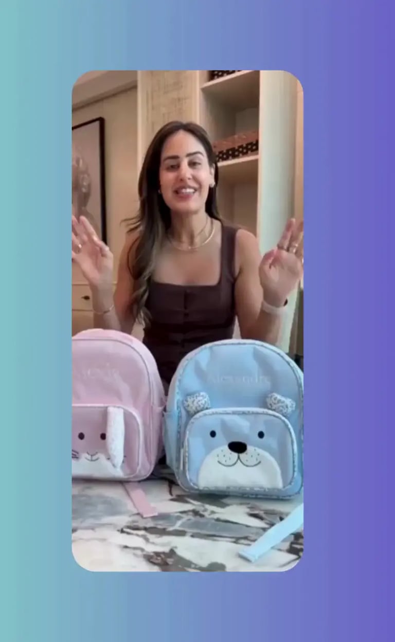 Video reel of a woman presenting pink and blue personalized children's backpacks with bunny and bear designs