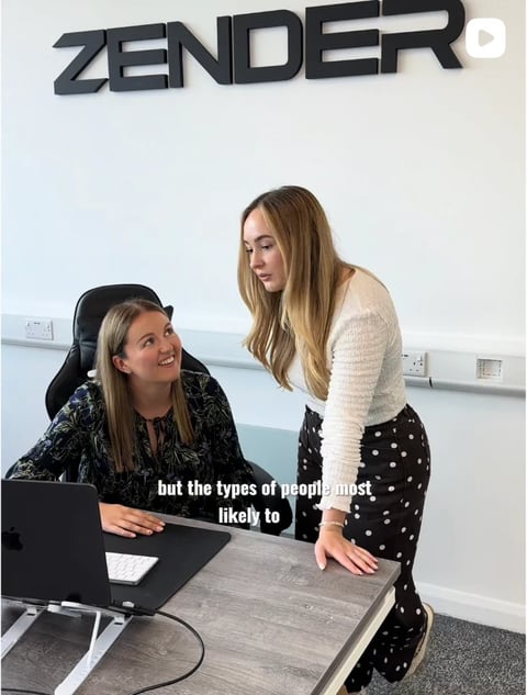 Two women in an office with ZENDER logo on wall, one seated at desk with laptop, one standing, with caption about types of people