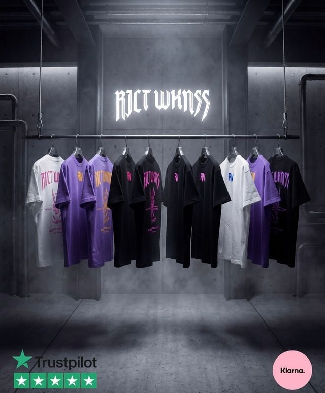 RICE KINGS retail display with hanging clothing collection in black, purple, and white graphic t-shirts illuminated by neon signage