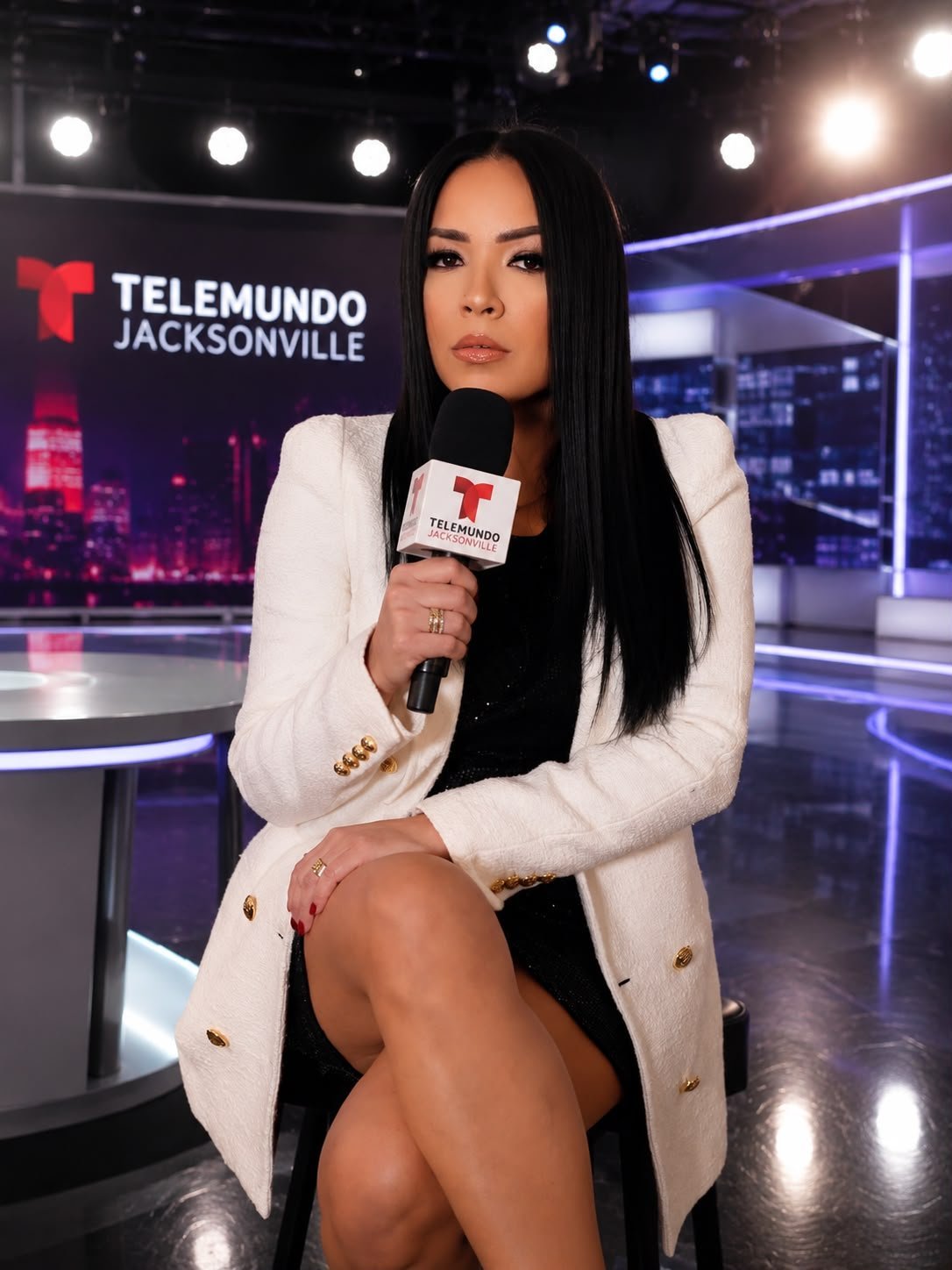 Woman holding microphone on set at Telemundo Jacksonville television studio